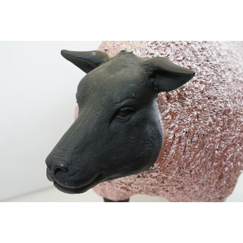 165 - Large painted fibreglass model of a sheep, in black & metallic pink. Measures approx 70cm H x 100cm ... 