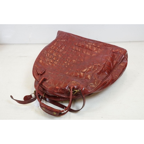 440 - Mulberry 'antique' leathers domed weekend holdall bag in maroon alligator embossed leather, the bag ... 