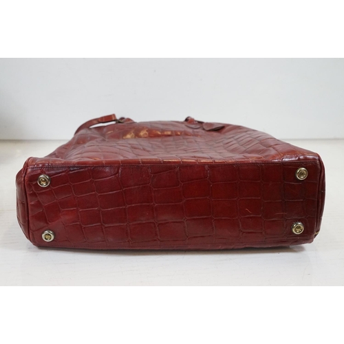 440 - Mulberry 'antique' leathers domed weekend holdall bag in maroon alligator embossed leather, the bag ... 