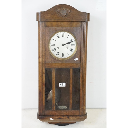 461 - Early 20th Century oak cased pendulum wall clock having a round dial with roman numeral chapter ring... 