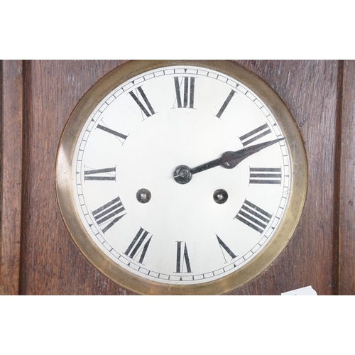 461 - Early 20th Century oak cased pendulum wall clock having a round dial with roman numeral chapter ring... 