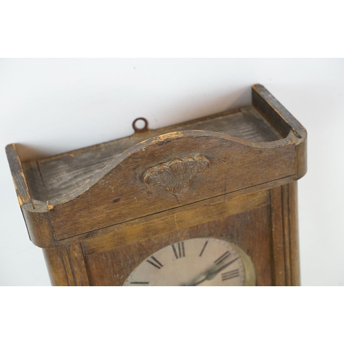 461 - Early 20th Century oak cased pendulum wall clock having a round dial with roman numeral chapter ring... 