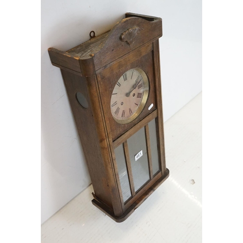 461 - Early 20th Century oak cased pendulum wall clock having a round dial with roman numeral chapter ring... 