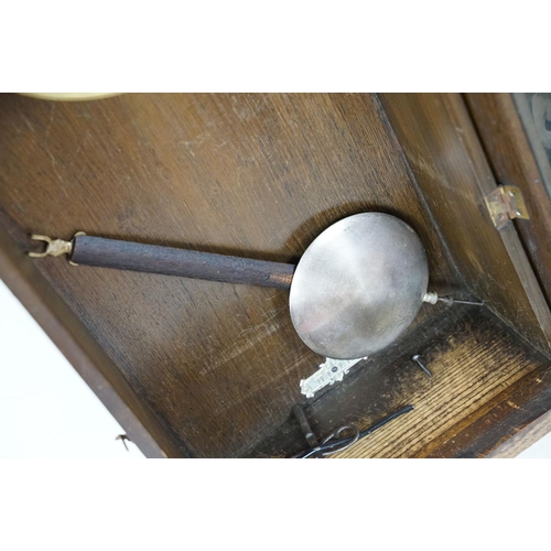 461 - Early 20th Century oak cased pendulum wall clock having a round dial with roman numeral chapter ring... 