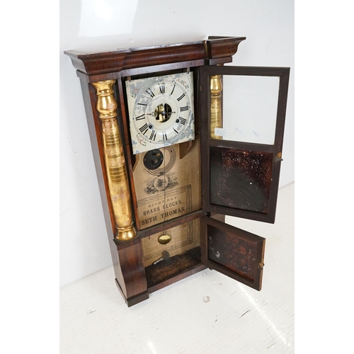 462 - Early 20th Century American eight day pendulum wall clock by Seth Thomas having a mahogany case with... 