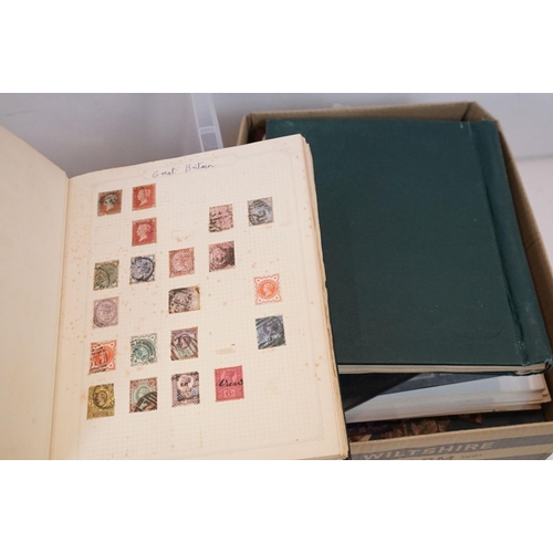 504 - A large collection of British, Commonwealth and world stamps contained within stamp albums together ... 