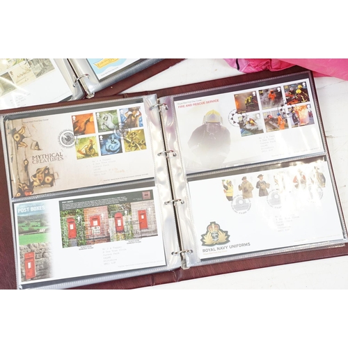 505 - A collection of mainly British first day covers contained within seven Royal Mail first day cover co... 