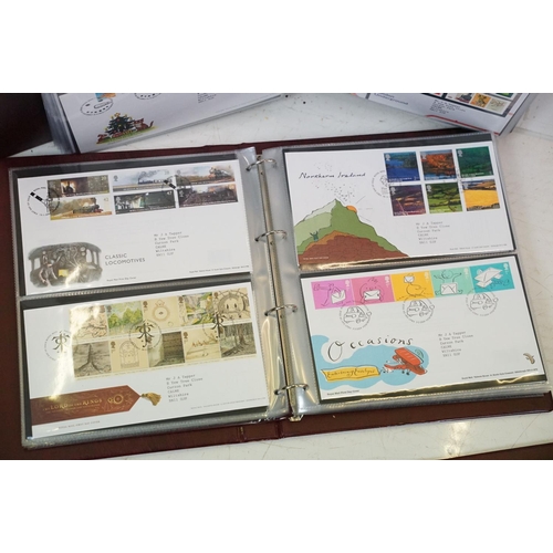 505 - A collection of mainly British first day covers contained within seven Royal Mail first day cover co... 