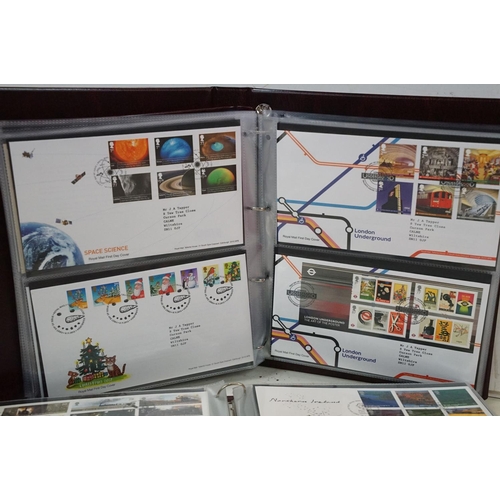 505 - A collection of mainly British first day covers contained within seven Royal Mail first day cover co... 