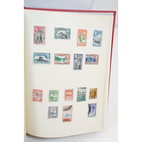 507 - A large collection of British, Commonwealth and world stamps contained within stamp albums together ... 