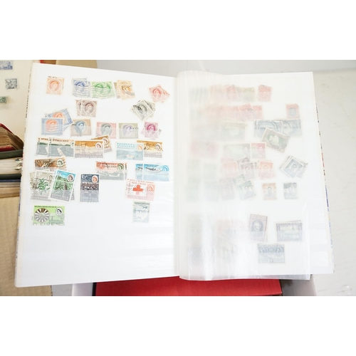 507 - A large collection of British, Commonwealth and world stamps contained within stamp albums together ... 