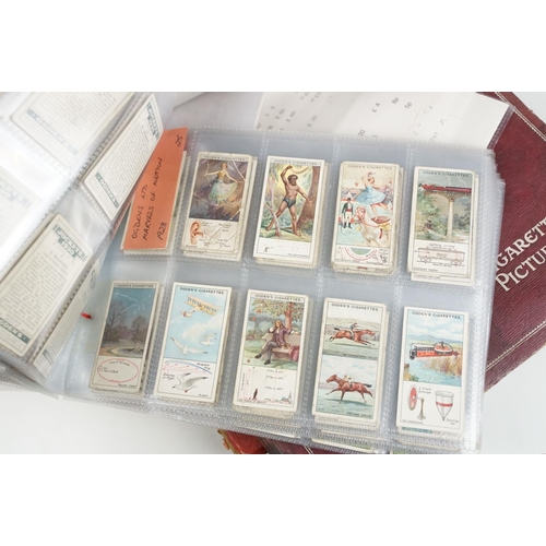 515 - A collection of cigarette cards within sleeves and albums to include Players, Wills and Ogdens examp... 