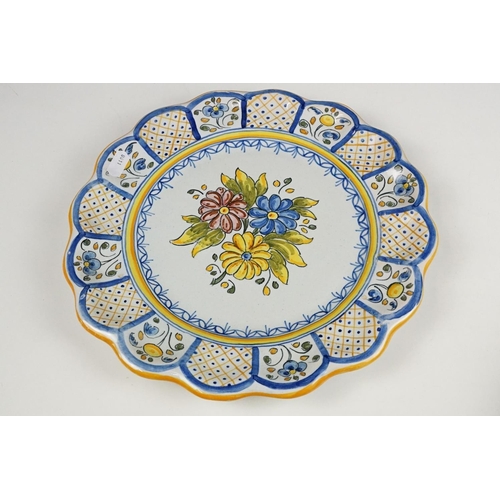 114 - Two Spanish Faience plates together with two Lord Nelson Limited edition cups produced for the Royal... 