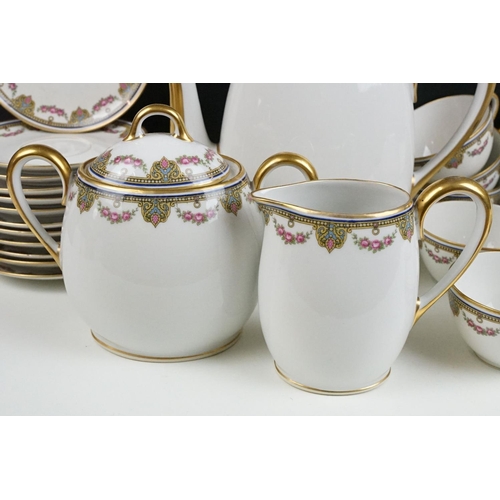 122 - 20th Century Limoges of France tea set with pink rose decoration (teapot, 12 cups & saucers, milk ju... 