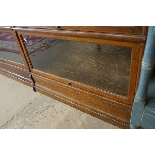 700 - Early 20th century Globe Wernicke Oak Three Section Modular Bookcase, each section with plain glazed... 