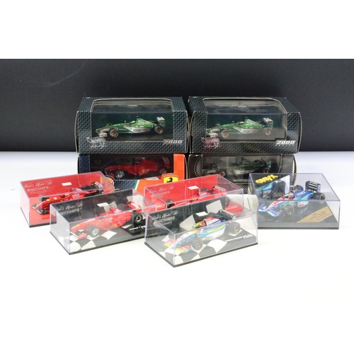 121 - Nine boxed / cased diecast racing car models to include examples from Onyx, Hot Wheels and Minichamp... 