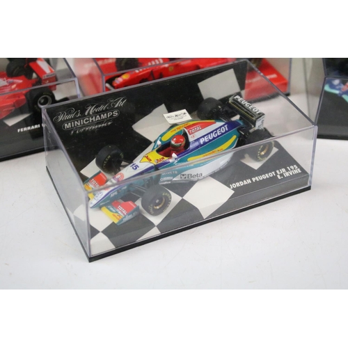 121 - Nine boxed / cased diecast racing car models to include examples from Onyx, Hot Wheels and Minichamp... 