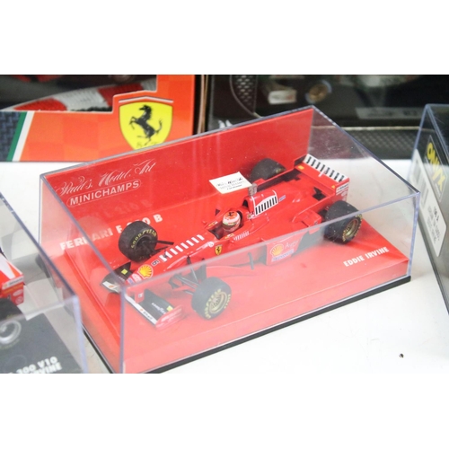 121 - Nine boxed / cased diecast racing car models to include examples from Onyx, Hot Wheels and Minichamp... 