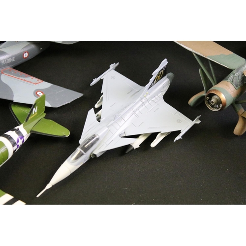 131 - Collection of around 90 model aircraft, mostly kit built military plastic models, also featuring a s... 