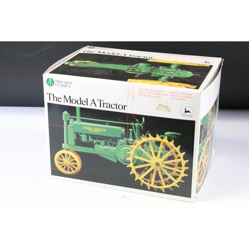 154 - Two boxed farming tractor diecast models to include Britains 9571 New Holland TR85 Combine Harvester... 