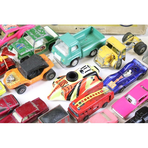 256 - Around 40 play worn diecast models, to include mid 20th C examples, featuring Corgi, Matchbox, Toots... 