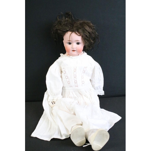 276 - Five early 20th century bisque headed dolls, clothed, with sleeping eyes, composition limbs & painte... 