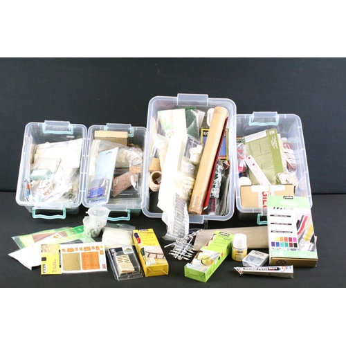 323 - Collection of model kit accessories to include various paints, scenery parts, plastic figures and pa... 