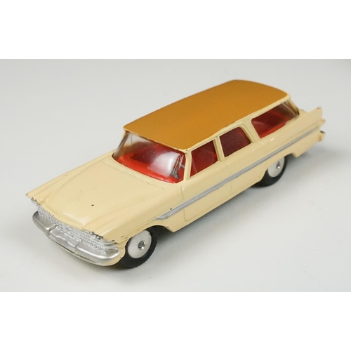 201 - Two boxed Corgi diecast models to include 219 Plymouth Sports Suburban Station Wagon in cream with f... 