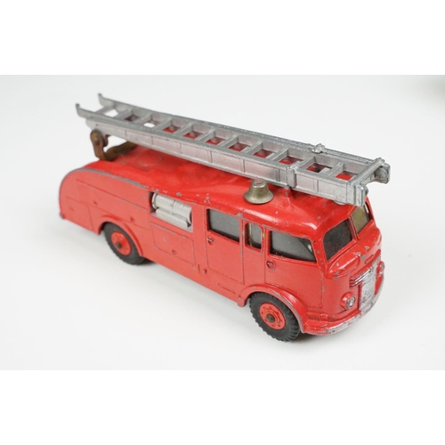 201A - Two boxed Dinky 955 Fire Engine diecast models in box variants, yellow box example shows play wear a... 