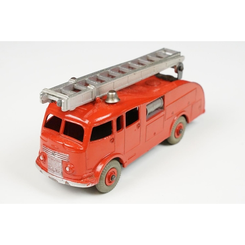 201A - Two boxed Dinky 955 Fire Engine diecast models in box variants, yellow box example shows play wear a... 