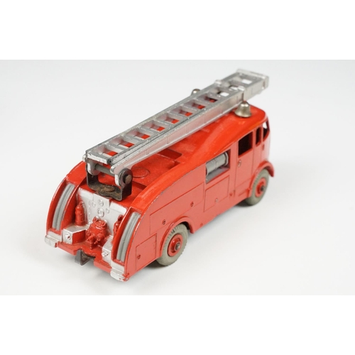 201A - Two boxed Dinky 955 Fire Engine diecast models in box variants, yellow box example shows play wear a... 