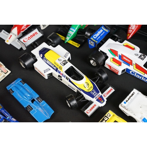 133 - Around 30 diecast model racing cars to include Corgi, Burago, Onyx etc, condition varies with some p... 