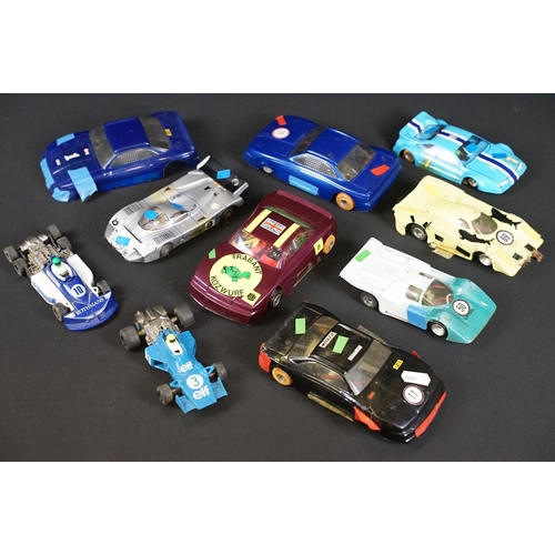 146 - Nine play worn slot cars to include 2 x Scalextric (C129 March 771 & C121 Tyrrell), International 32... 