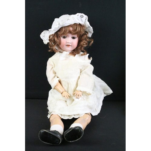 280 - Five early 20th C Armand Marseille bisque headed dolls, clothed, with sleeping glass eyes, jointed c... 