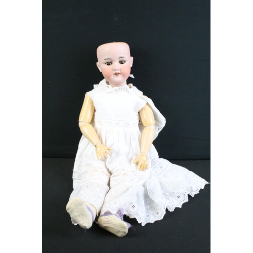 280 - Five early 20th C Armand Marseille bisque headed dolls, clothed, with sleeping glass eyes, jointed c... 