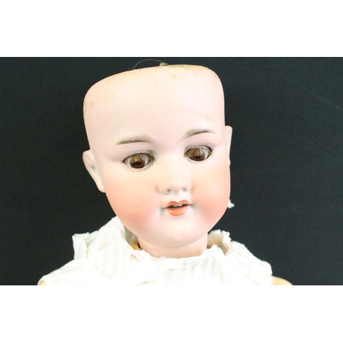 280 - Five early 20th C Armand Marseille bisque headed dolls, clothed, with sleeping glass eyes, jointed c... 