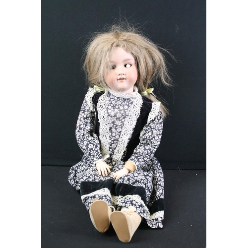 280 - Five early 20th C Armand Marseille bisque headed dolls, clothed, with sleeping glass eyes, jointed c... 