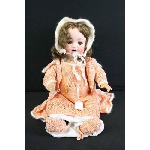 288 - Four early 20th century German bisque headed dolls, clothed, with sleeping eyes, composition limbs a... 