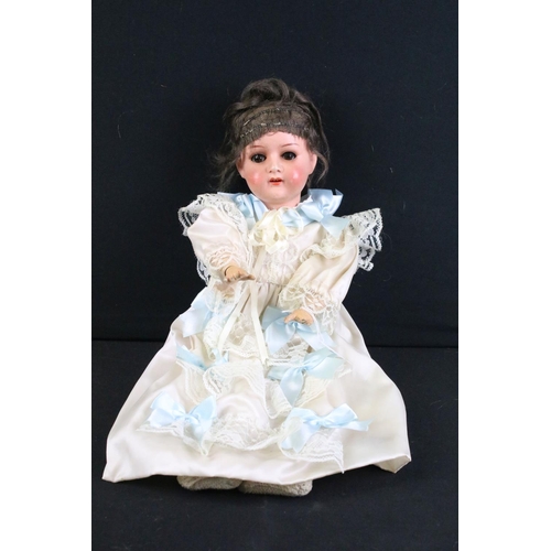 288 - Four early 20th century German bisque headed dolls, clothed, with sleeping eyes, composition limbs a... 