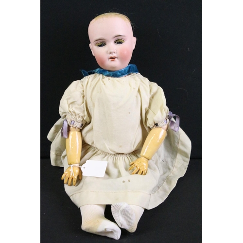 288 - Four early 20th century German bisque headed dolls, clothed, with sleeping eyes, composition limbs a... 