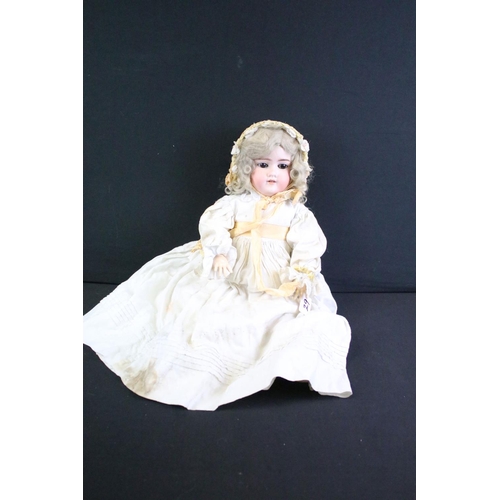 290 - Five early 20th C Armand Marseille bisque headed dolls with glass eyes, jointed composition limbs & ... 