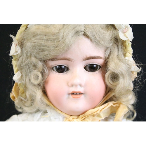 290 - Five early 20th C Armand Marseille bisque headed dolls with glass eyes, jointed composition limbs & ... 