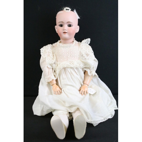 291 - Five early 20th C Simon & Halbig bisque headed dolls, clothed, with composition limbs, sleeping eyes... 