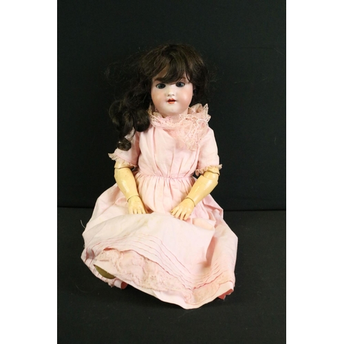 291 - Five early 20th C Simon & Halbig bisque headed dolls, clothed, with composition limbs, sleeping eyes... 