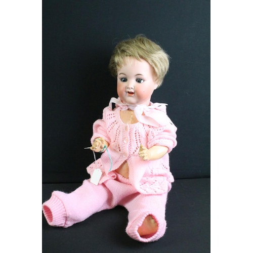 292 - Four early 20th C Armand Marseille bisque headed dolls, clothed, with sleeping eyes, jointed composi... 