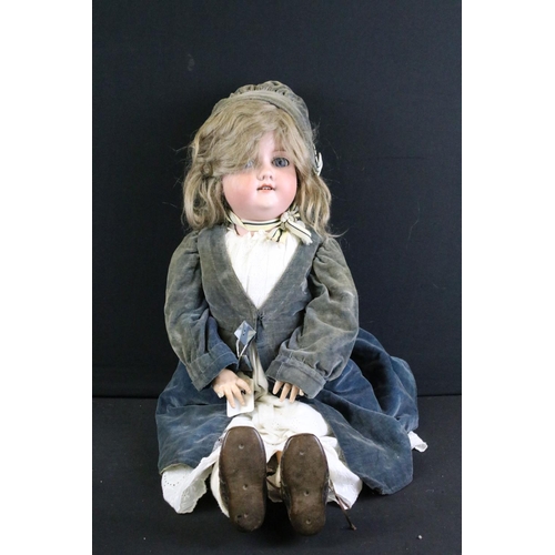 292 - Four early 20th C Armand Marseille bisque headed dolls, clothed, with sleeping eyes, jointed composi... 