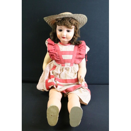 296 - Late 19th / early 20th century doll with wax covered head, glass eyes, composition hands & shoes and... 