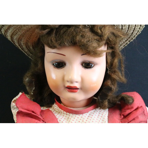 296 - Late 19th / early 20th century doll with wax covered head, glass eyes, composition hands & shoes and... 