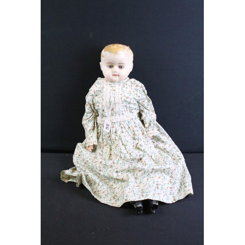 296 - Late 19th / early 20th century doll with wax covered head, glass eyes, composition hands & shoes and... 