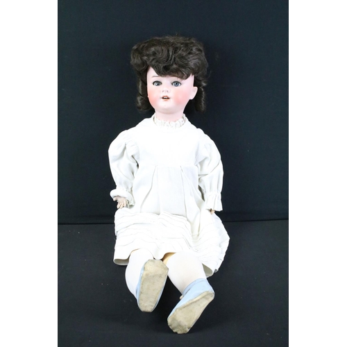 296A - Three early 20th century Heubach Koppelsdorf bisque headed dolls, clothed, with composition limbs, s... 